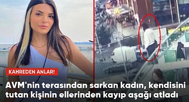 AVM'nin terasından sarkan kadın, kendisini tutan kişinin ellerinden kayıp aşağı atladı